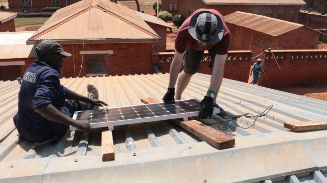 Installation of the S4 Solar Panel at Embangweni Hospital. (Image courtesy of Grand Valley State University.)