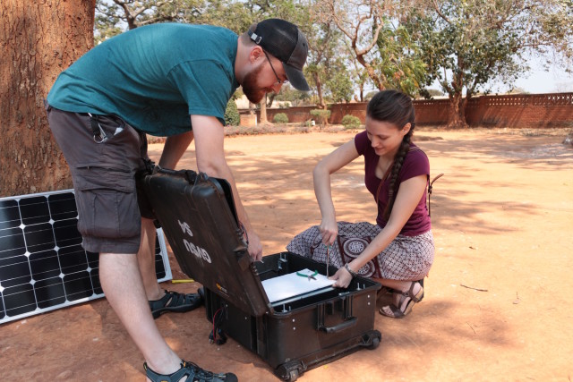 Engineering graduate students Patrick McCarthy and Sofia Fanourakis prepare to install a Solar Suction Surgery System. (Image courtesy of Grand Valley State University.)