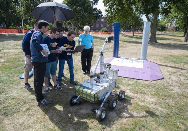 West Virginia University Mountaineers team members work on their robot during the Level 2 competition at Worcester Polytechnic Institute in Worcester, Massachusetts. (Image courtesy of NASA/Joel Kowsky.)