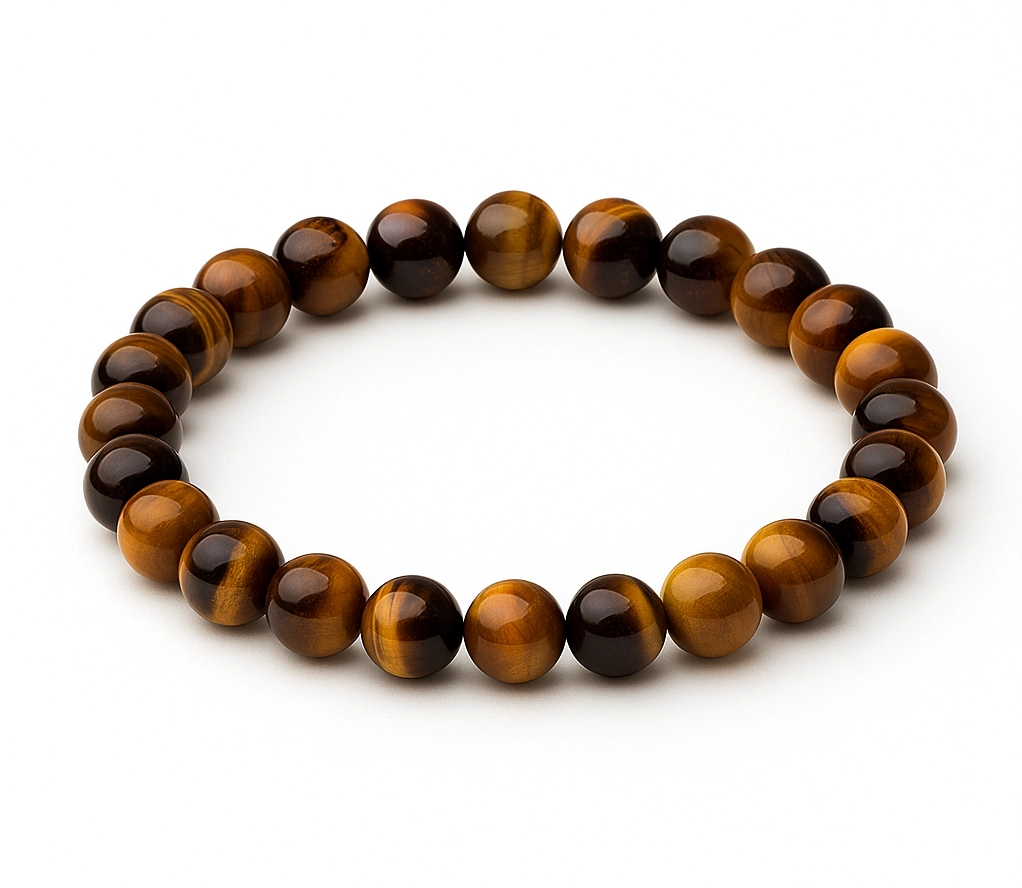Close-up of tiger's eye bead capturing light-reflecting bands