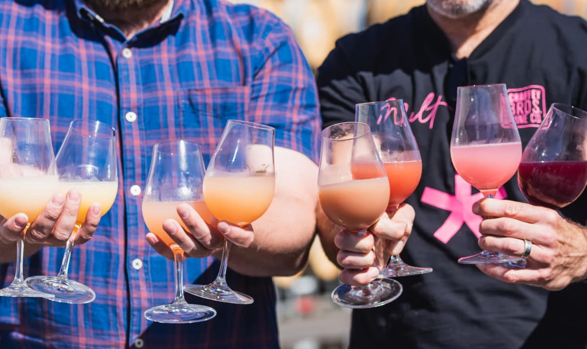 Different coloured glasses of wine