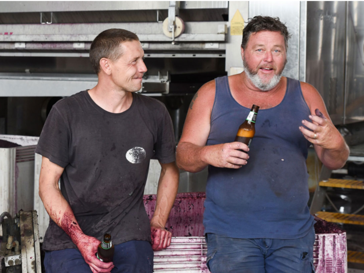 Kym Teusner and Mick Page sinking a cold one