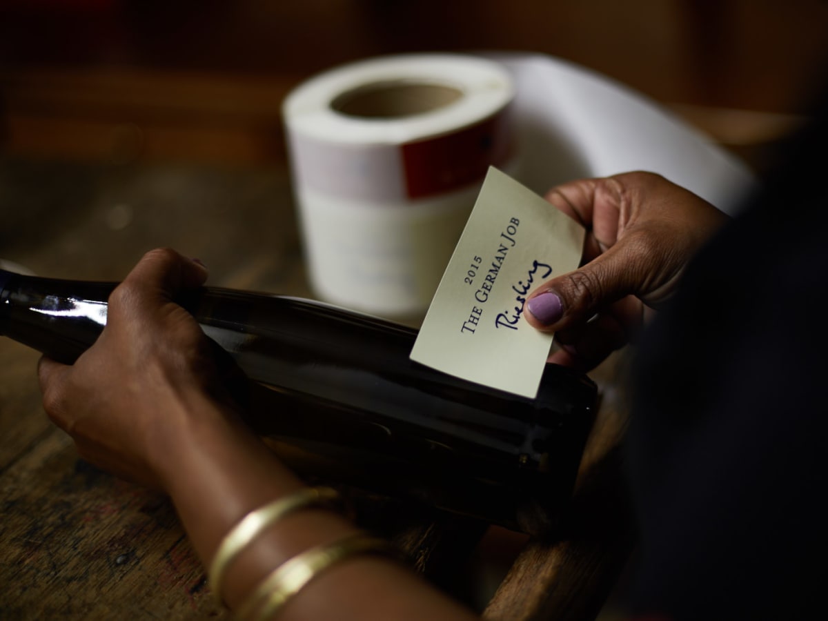 Wine bottle being labelled