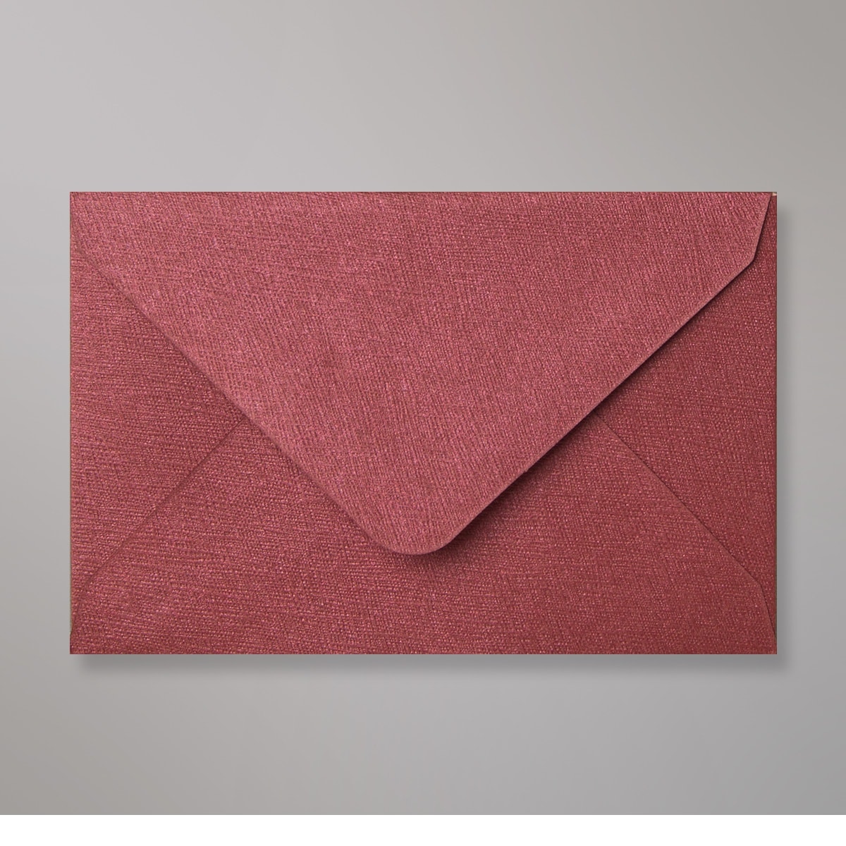 Enveloppe à grains bordeaux 62x94 mm