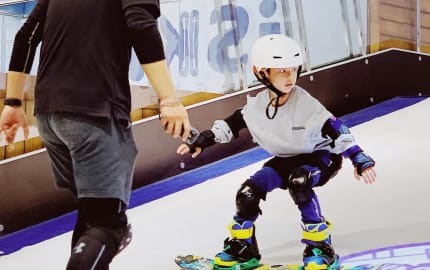 Family indoor skiing and snowboarding in tropical Taiwan