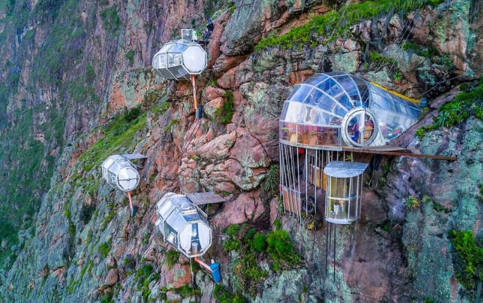 Like eagle’s perspective sleeping in condor’s nest, luxury capsule hanging from top of mountain in Sacred Valley of Peru