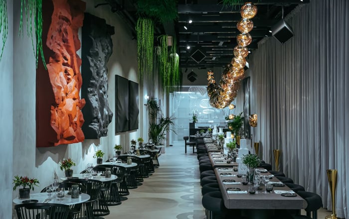 Experimental space with theatrical backdrop to experience gourmet gastronomy and Tom Dixon designs