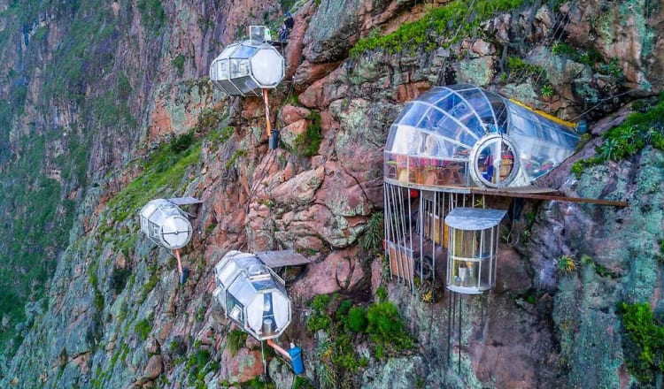 Like eagle’s perspective sleeping in condor’s nest, luxury capsule hanging from top of mountain in Sacred Valley of Peru