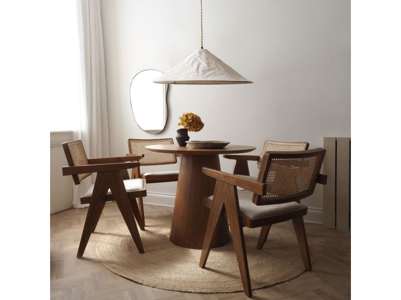 Space saving solid wood round dining table for modern Indian homes