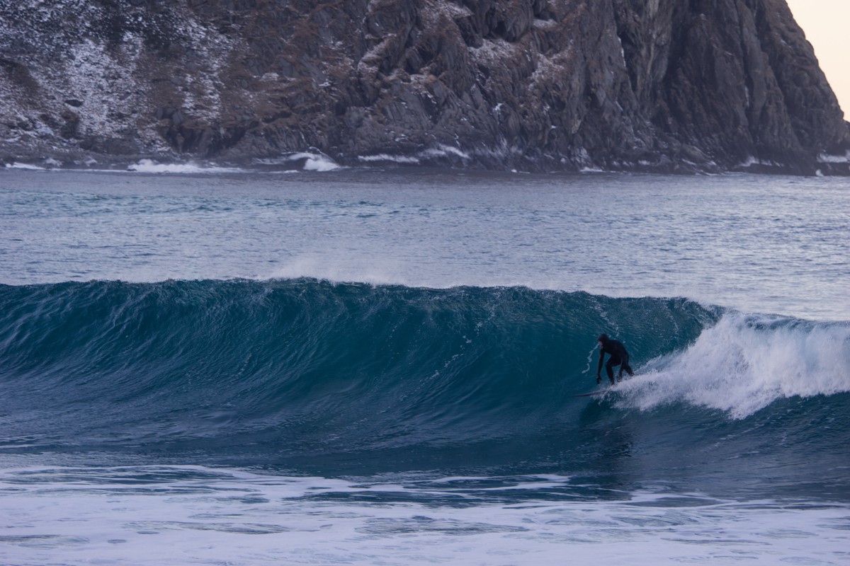 cliff overlooking surfer