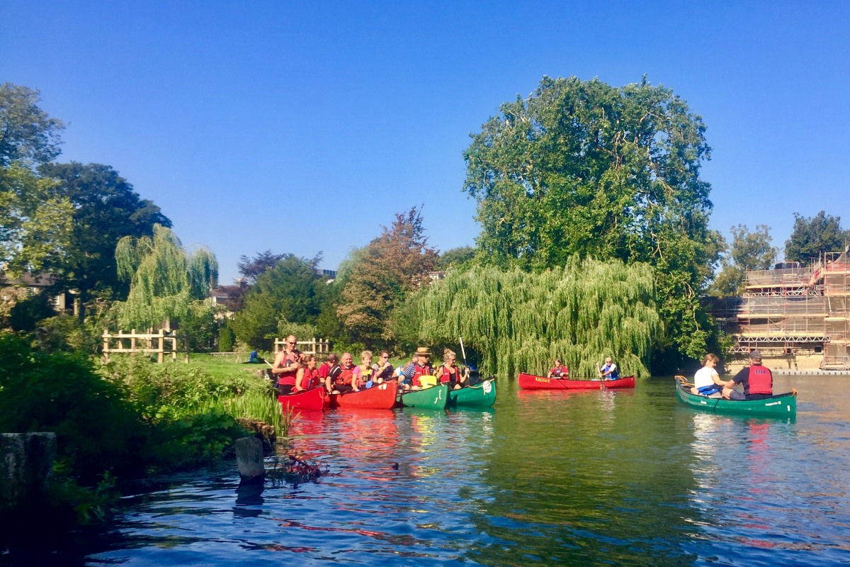 canoeing through narrow stream