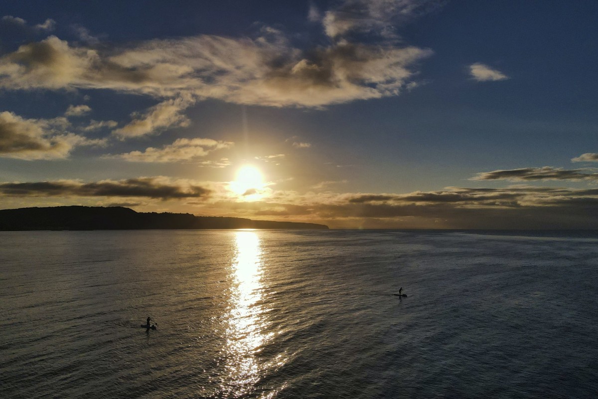 SUP with sunset on the sea 