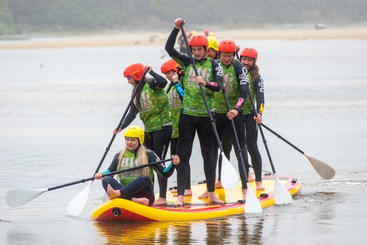 big green surf school team eola monster sup