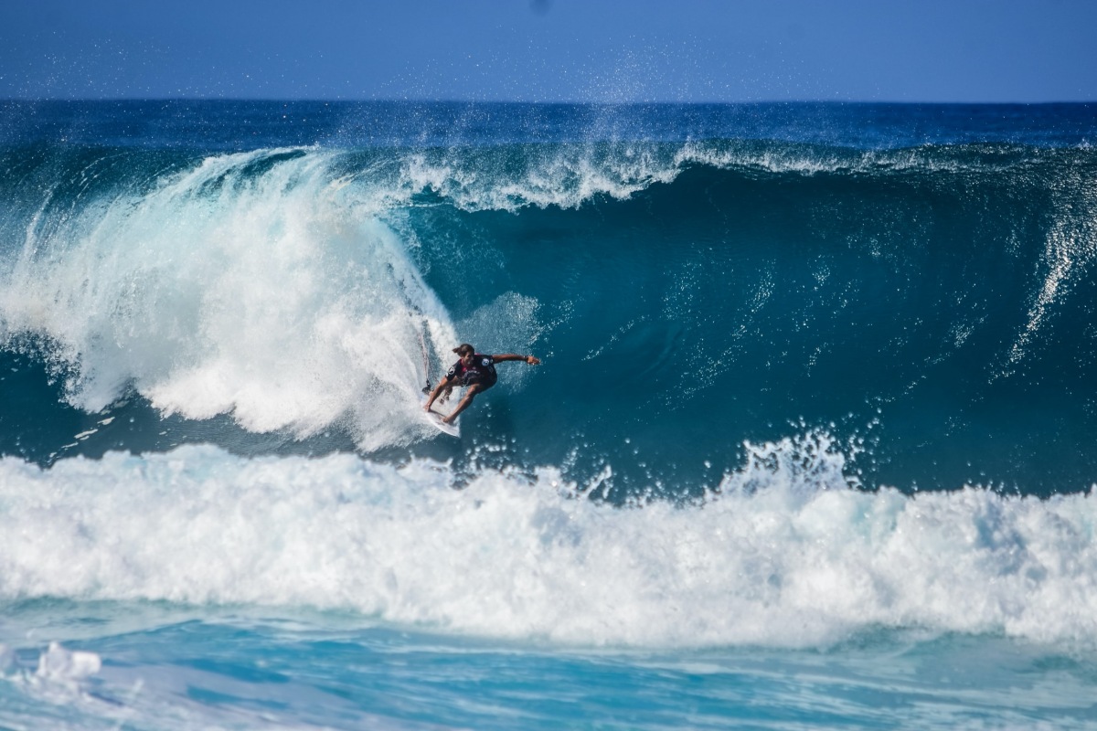 Image of surfer blue wave