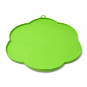 Bright green silicone flower shaped placemat for cat bowl