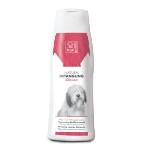 Pink &amp; white plastic bottle of detangling dog shampoo