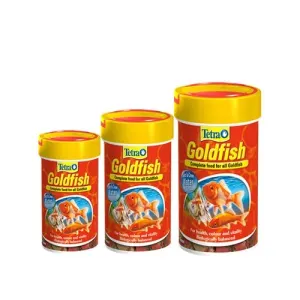 Tetra Goldfish Flakes different sizes next to each other