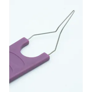 Tick Remover For Pets close up of the metal tick remover