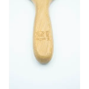 Bamboo Rake Comb for Dogs close up of bamboo handle