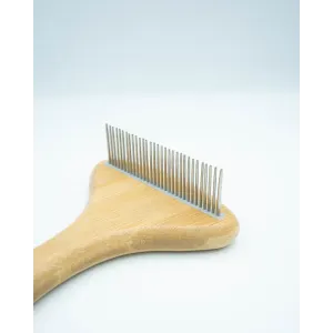 Bamboo Rake Comb for Dogs close up of metal rotating teeth