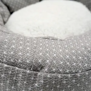 Dotty Feline Cat Bed close up grey material, with white dots and fleece inner