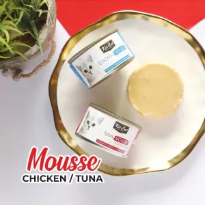 Kit Cat Mousse With Meal Topper Adult Cat Treat chicken and tuna in tins on a plate