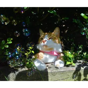 Pet Qwerks Kitty Catnip IncrediBubbles lifestyle with cat in bushes