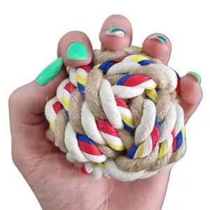 Marltons Rope Bone - Ball Shape Dog Toy - small with hand size comparison