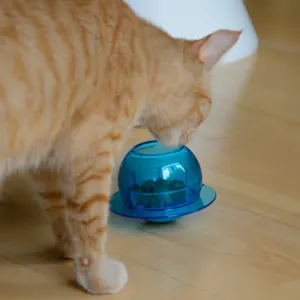 Fishbowl Cat Feeder Toy lifestyle with ginger cat