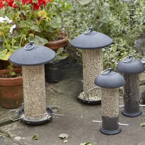 Gardman Black Metal Birdfeeder sizes on ground with seed