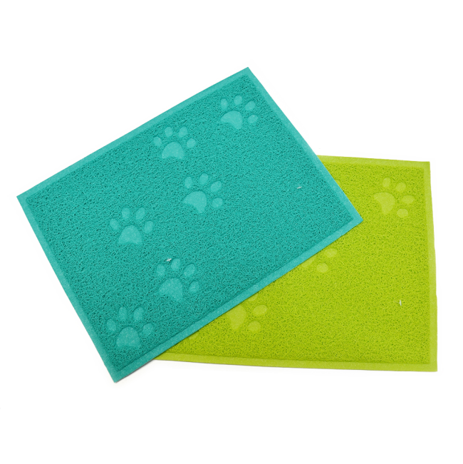 Turquoise and lime green textured cat litter mat embossed with multiple paw shapes