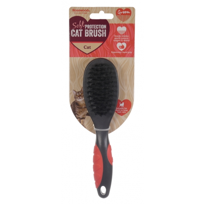 Purple cat grooming brush with black bristles