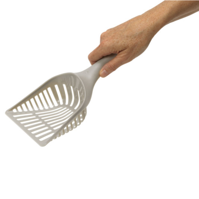 Grey litter scoop being held