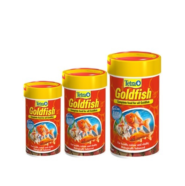 Tetra Goldfish Flakes different sizes next to each other