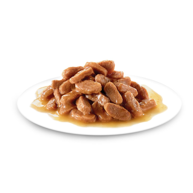 Royal Canin Kitten Sterilised Wet Cat Food - Gravy on plate with brown meaty bits and gravy
