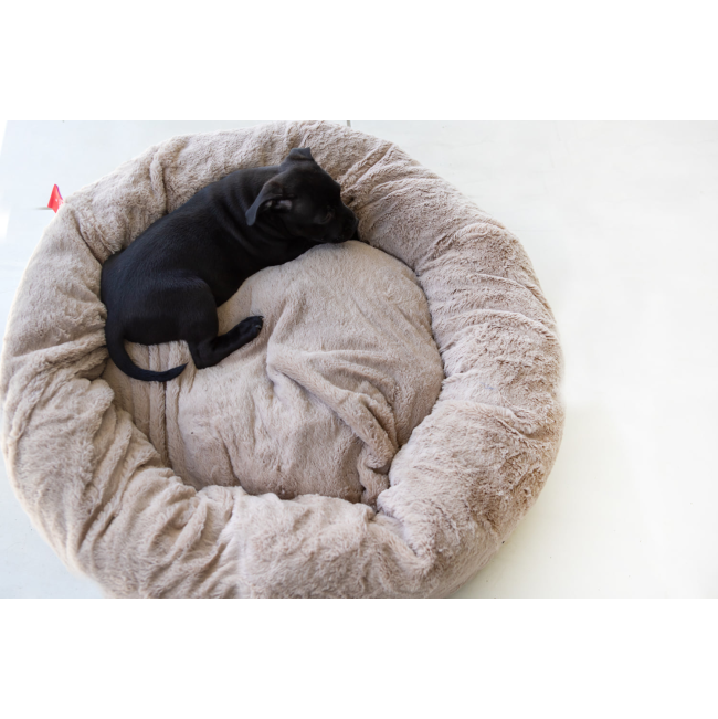 Calming Cuddler Pet Bed with black puppy