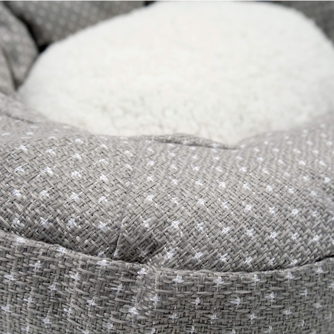 Dotty Feline Cat Bed close up grey material, with white dots and fleece inner