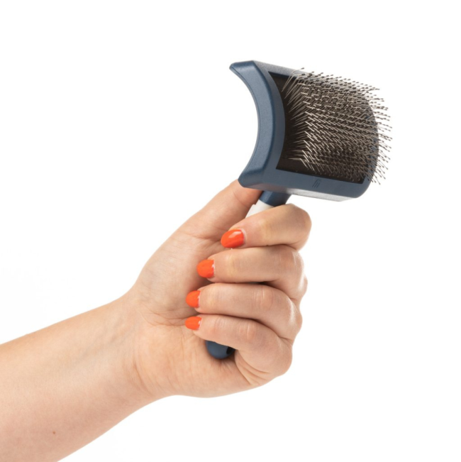 Mikki Doodles Grooming Kit slicker brush in hand