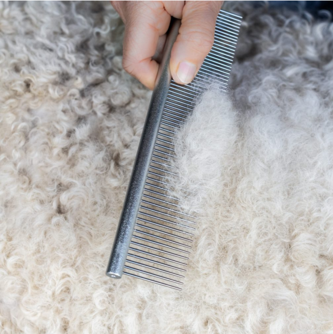 Mikki Doodles Grooming Kit comb being used on fur coat