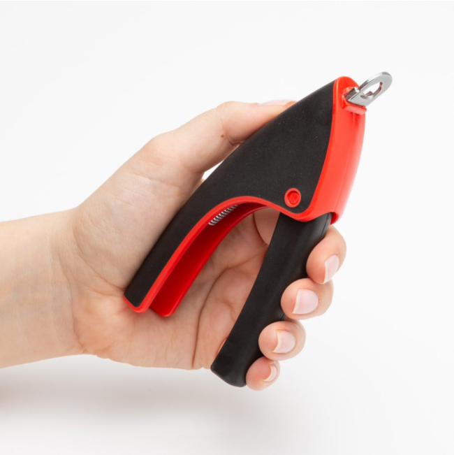 Mikki Guillotine Nail Clippers in hand for size to scale