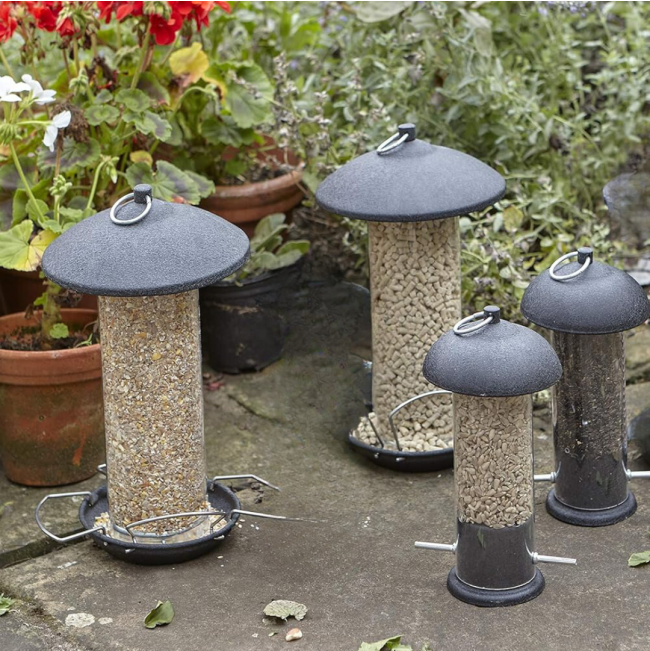 Gardman Black Metal Birdfeeder sizes on ground with seed