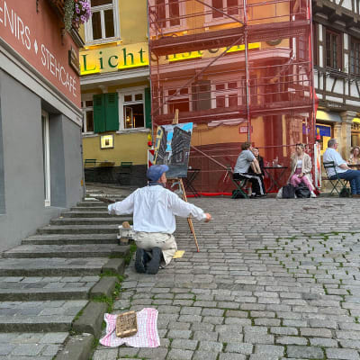 Painter painting the street and buildings