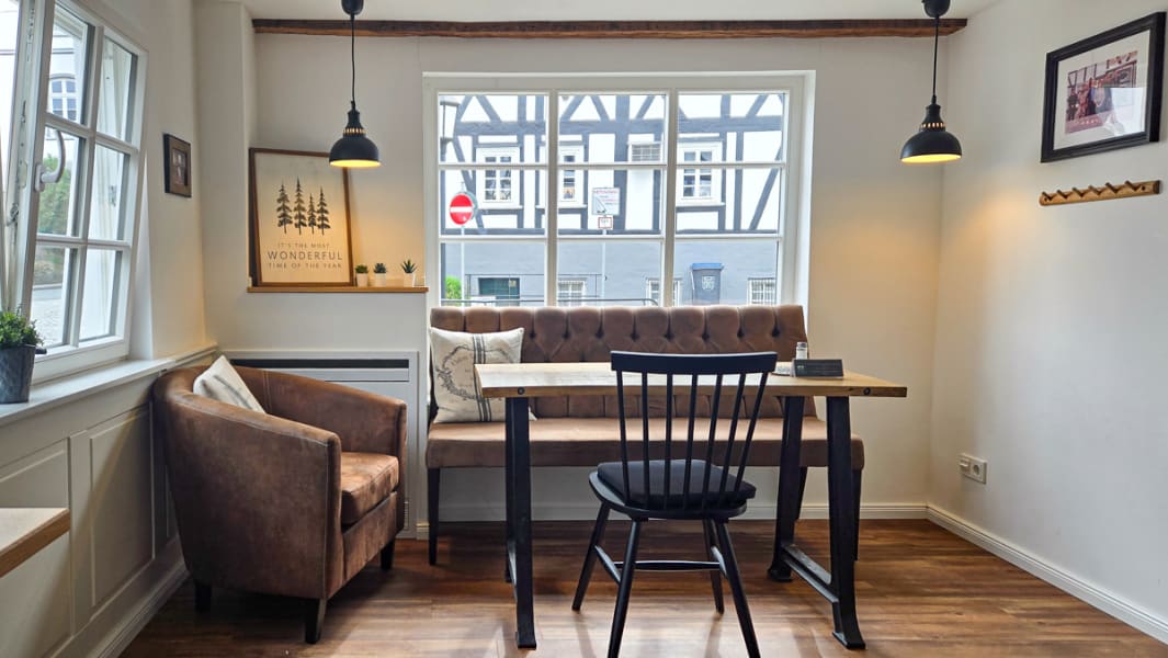 Couch and dining table in common kitchen