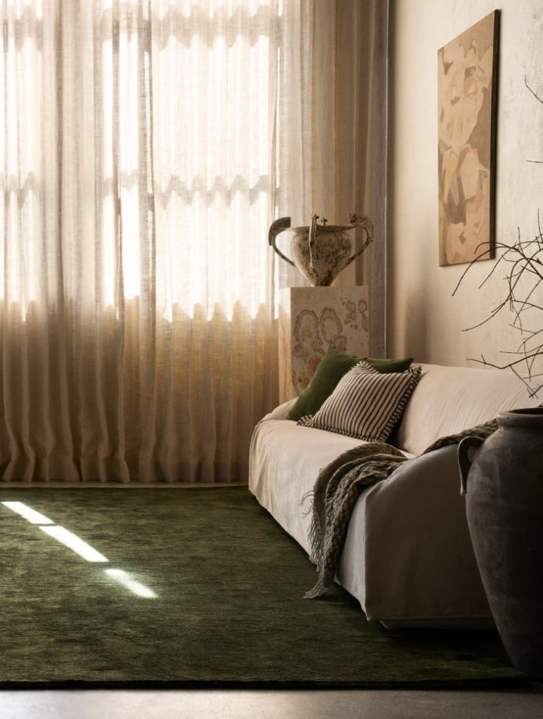 Luxury custom area rug displayed in elegant home interior