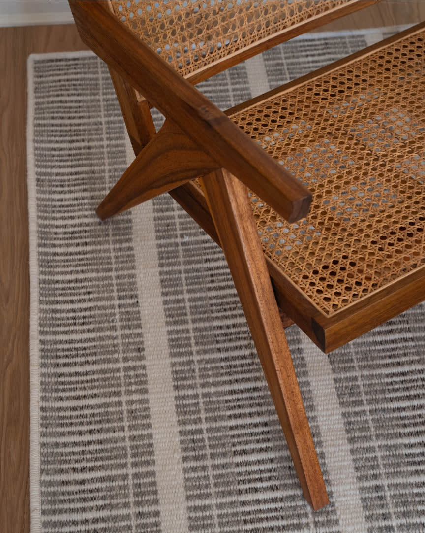 a picture of a rug with a chair