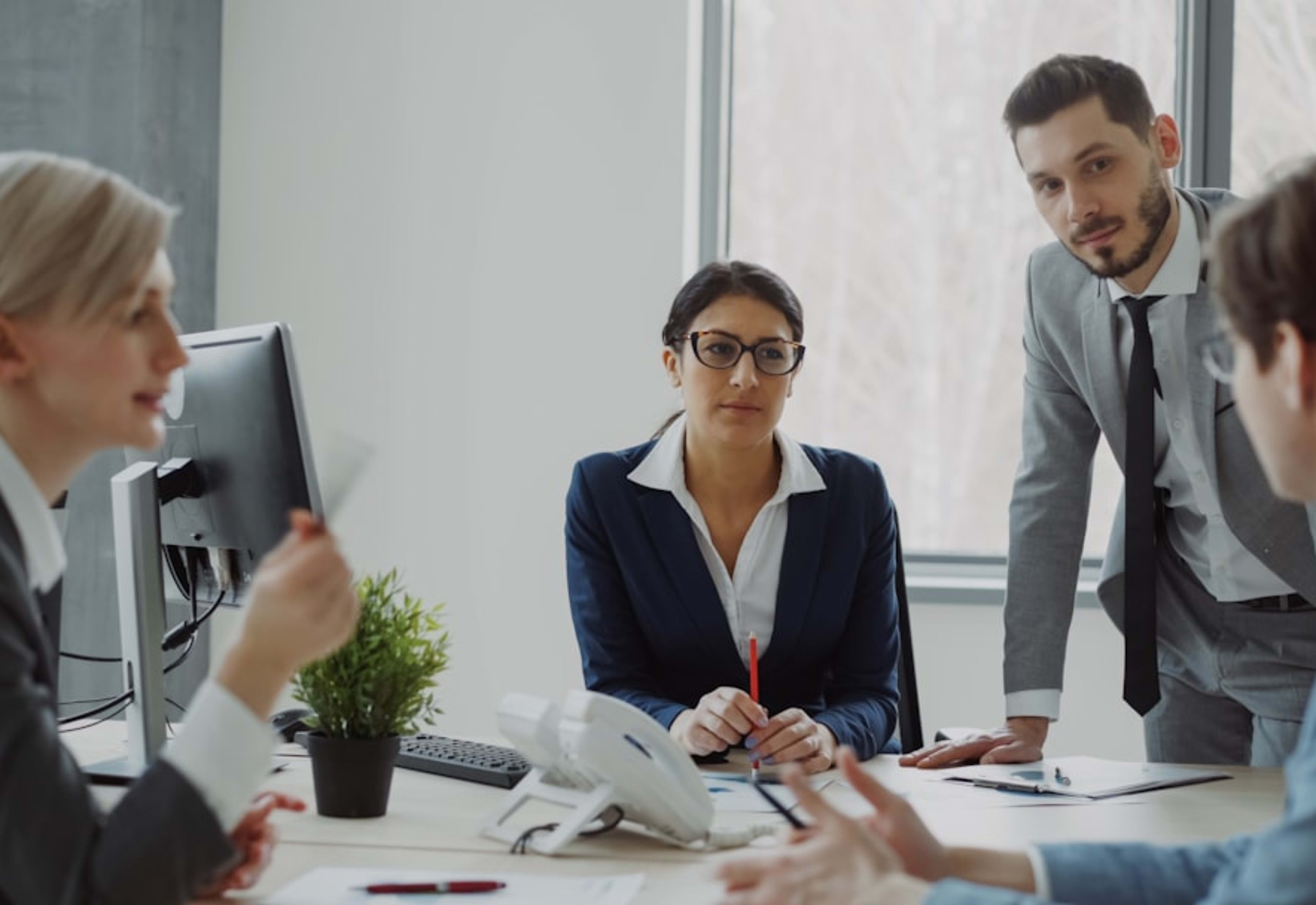 Professional team collaborating in a modern office meeting
