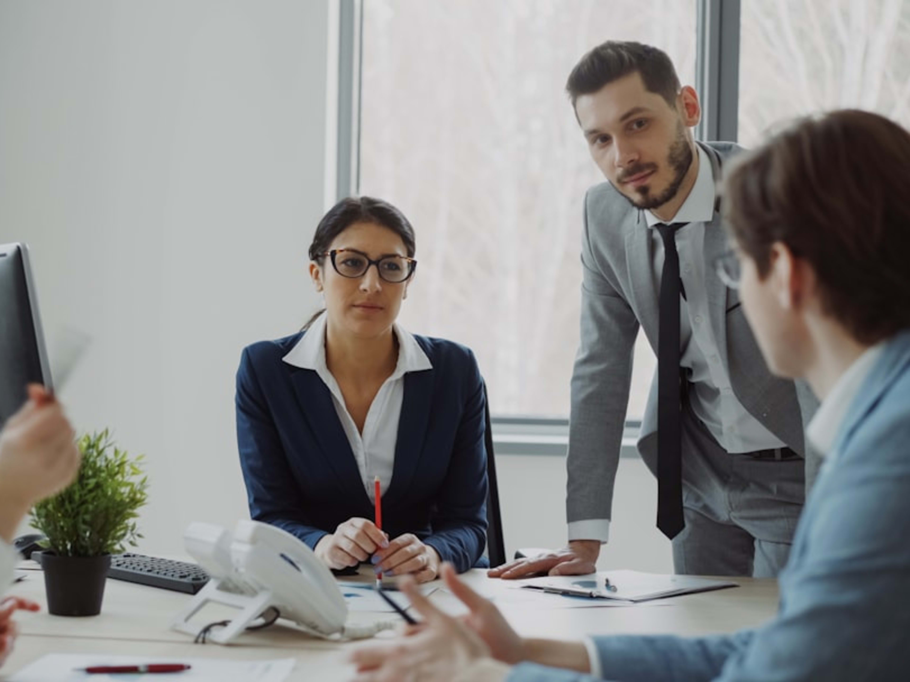 Professional team collaborating in a modern office meeting