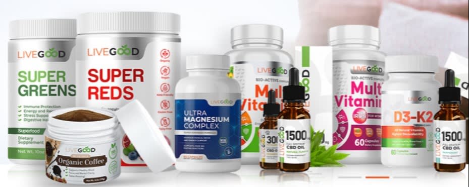 A selection of LiveGood supplements, including Super Greens, Super Reds, multivitamins, CBD oil, and magnesium complex, displayed with organic coffee powder.