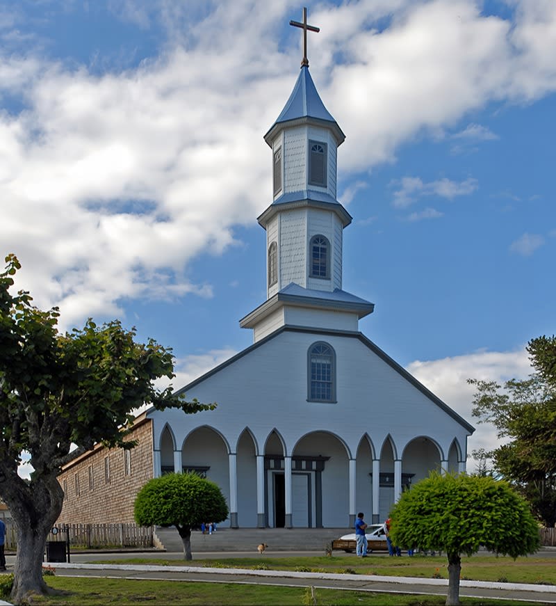 vertical-shot-church-with-blue-cloudy-sky-background - UPSCALE