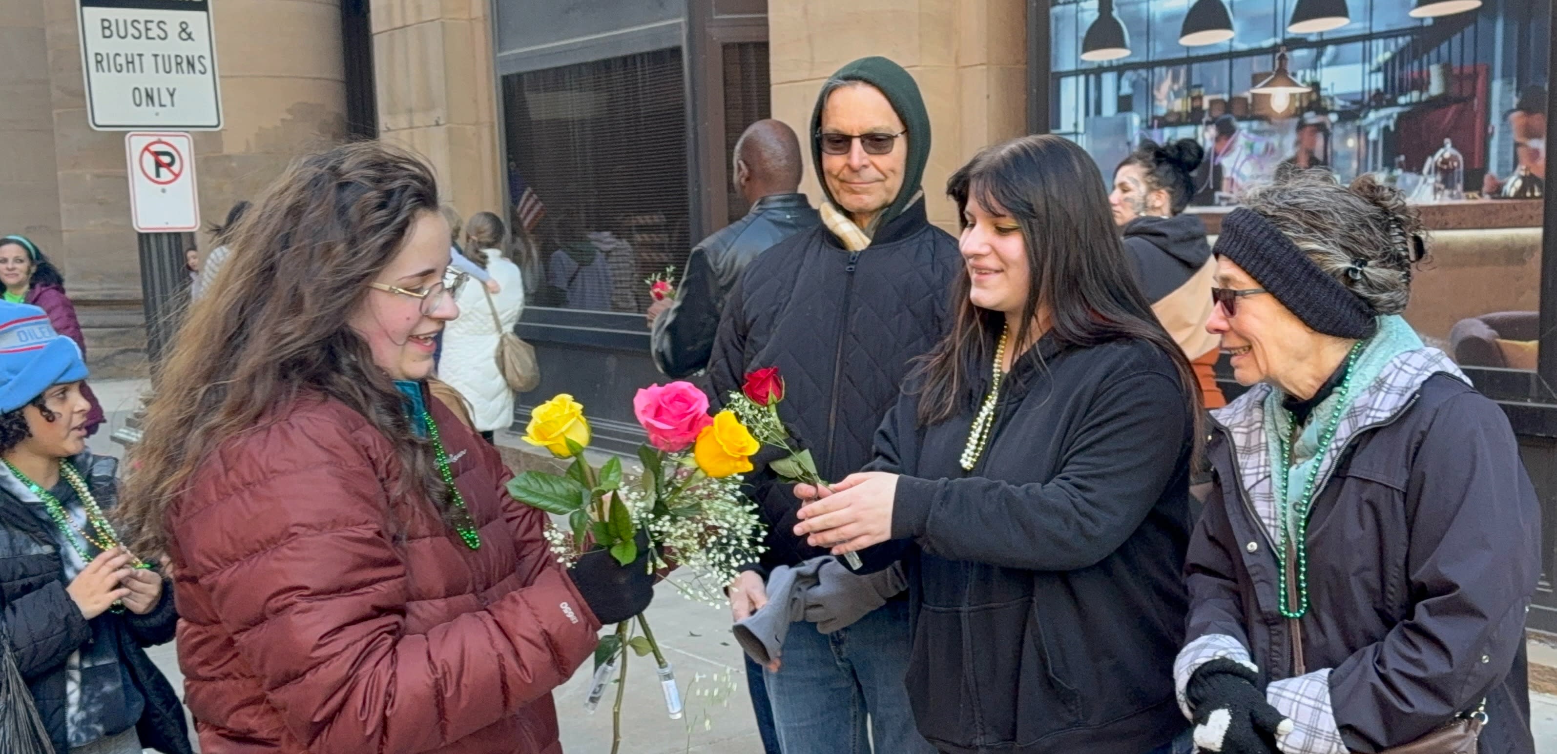 Volunteers preparing roses and organizing for the parade procession.